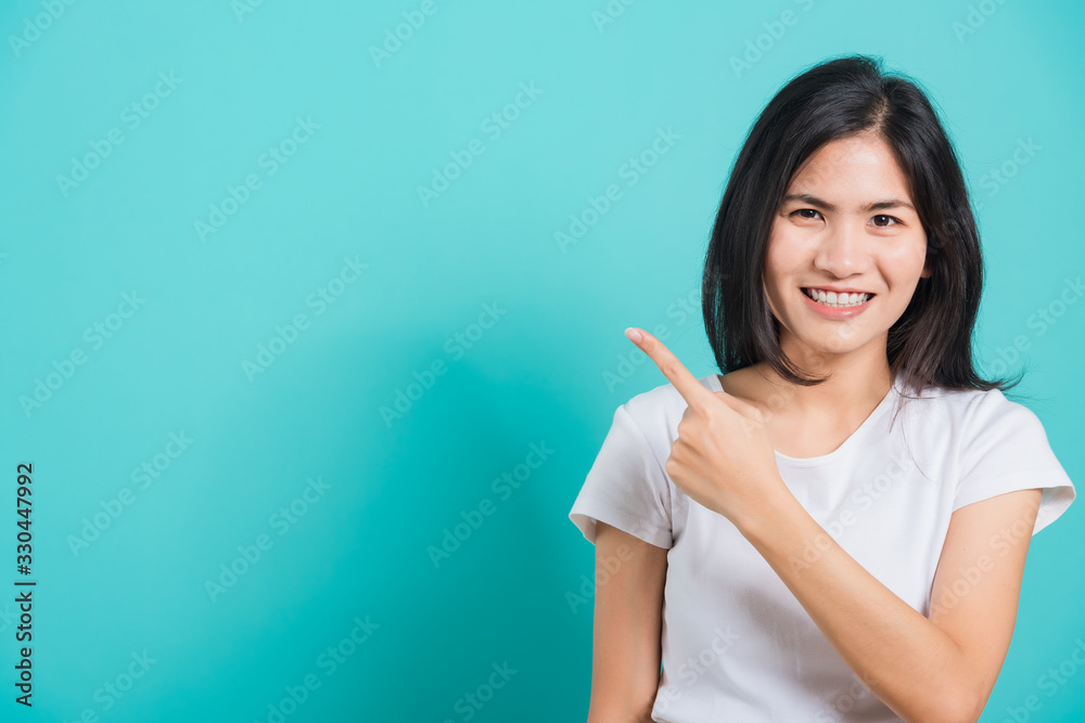 Portrait Asian beautiful young woman standing pointing finger up Portrait Asian beautiful young woman standing pointing finger up