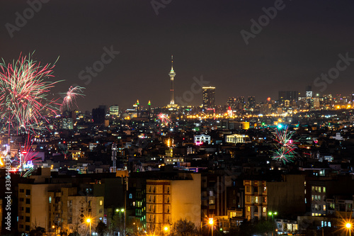 Beautiful and colorful skyline of Tehran city the capital of Iran with amazing fire works in the sky. © PR ART