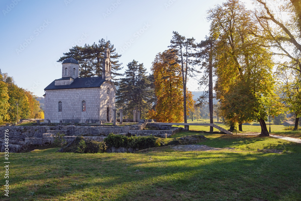 Sunny autumn day. Montenegro, Cetinje town. Church of Birth of Our Lady ( Court Church on Cipur ) Sunny autumn day. Montenegro, Cetinje town. Church of Birth of Our Lady ( Court Church on Cipur )