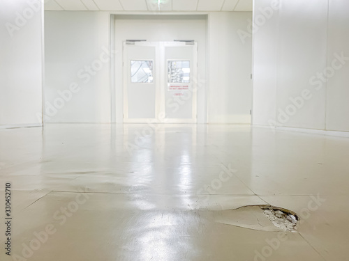 cracked floor in factory,dilapidated building,broken corridor 