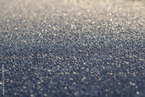 Frost on the car. Details of the car. Getting the sun and frost. Early spring Sunrise Morning.