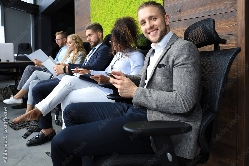 Modern business people waiting for job interview Modern business people waiting for job interview