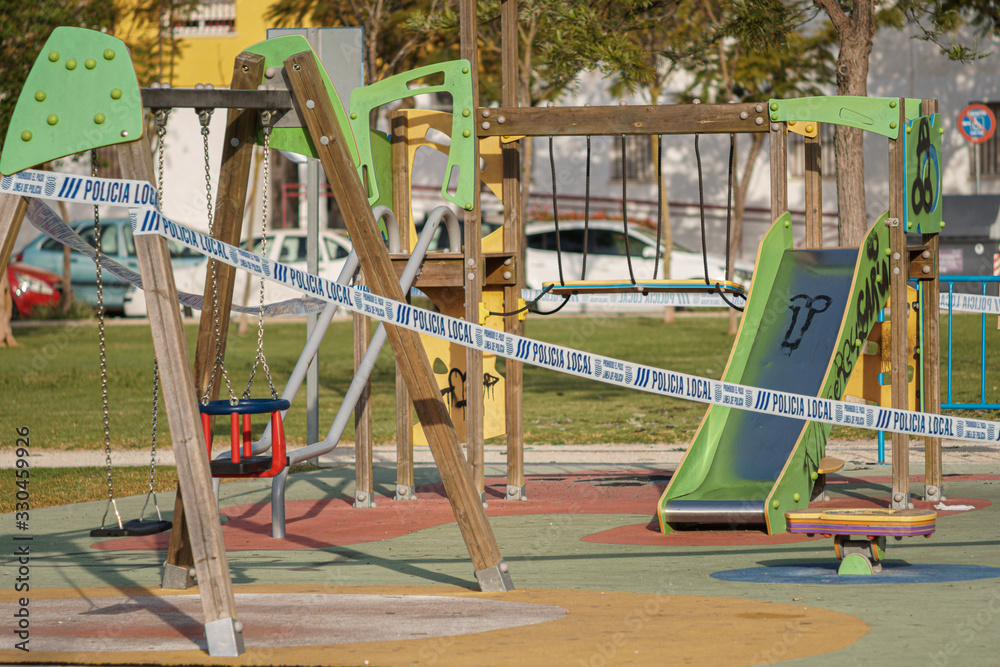 Fototapeta premium Park closed and sealed by the police, due to the state of alarm in Spain, due to the coronavirus.