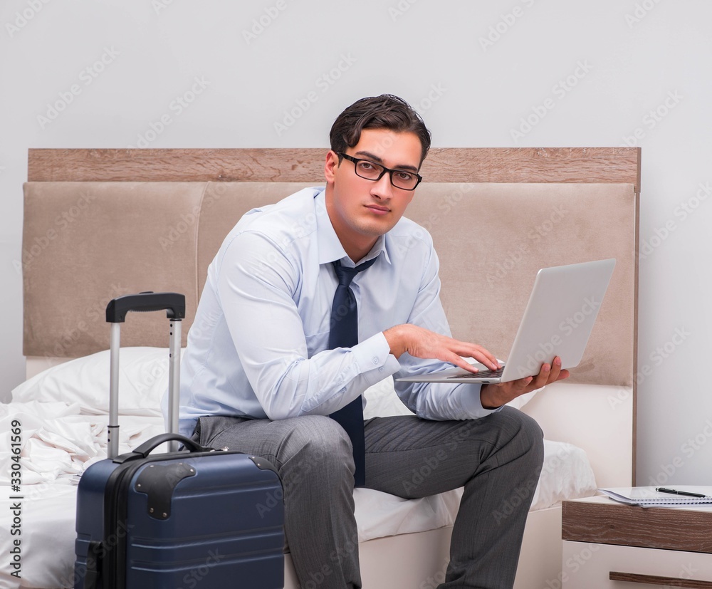 Businessman working during business trip in hotel Businessman working during business trip in hotel