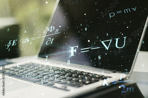 Creative scientific formula concept on modern laptop background. Multiexposure