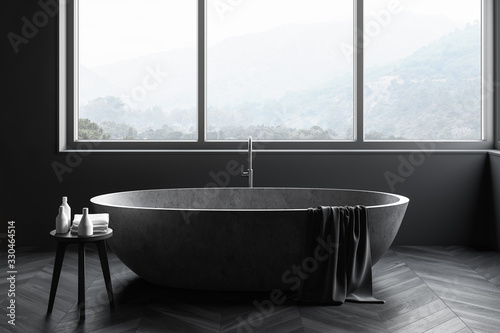 Gray bathroom interior with stone tub, close up