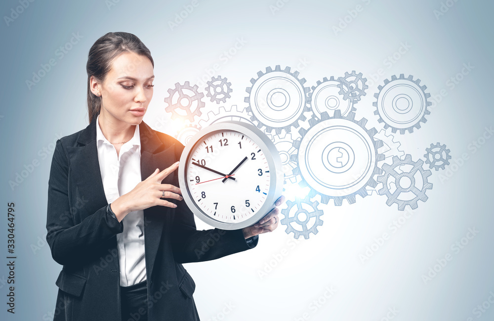 Young businesswoman with clock, planning concept Young businesswoman with clock, planning concept