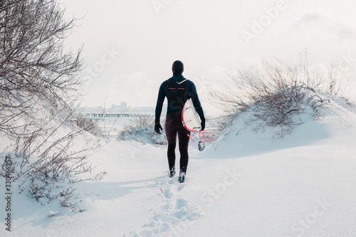 Sticker Cold winter and male surfer with surfboard