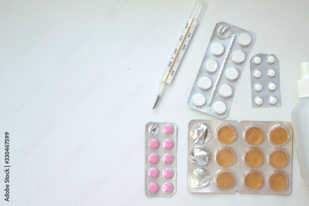 Background of pills and thermometer: pandemic virus infection from Wuhan, China, novel Coronavirus outbreak. Background of pills and thermometer: pandemic virus infection from Wuhan, China, novel Coronavirus outbreak.