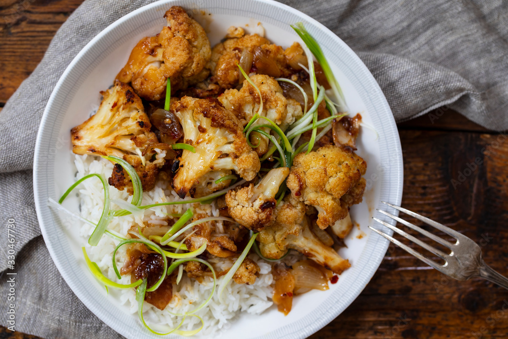 Roast cauliflower with adobo sauce and rice