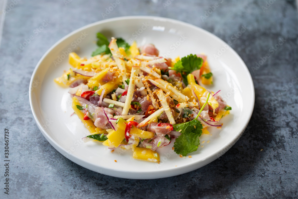 Tuna ceviche with coconut milk, mango, chilli and lime juice Tuna ceviche with coconut milk, mango, chilli and lime juice