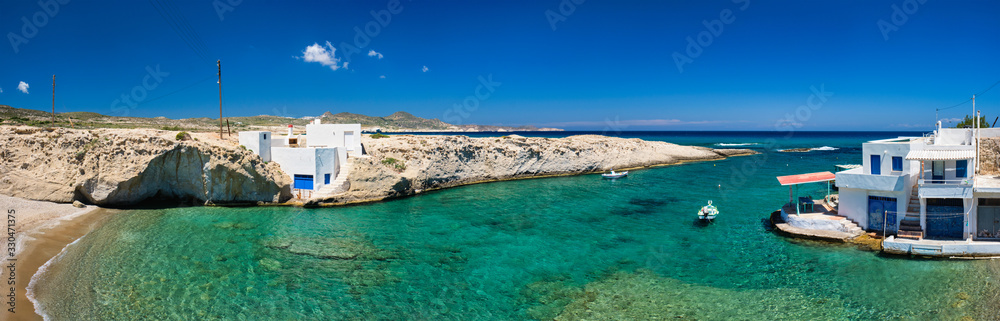 Fototapeta premium Crystal clear blue water at MItakas village beach, Milos island, Greece.