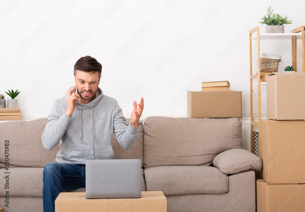 Young man raging on repair company and talking by phone Young man raging on repair company and talking by phone