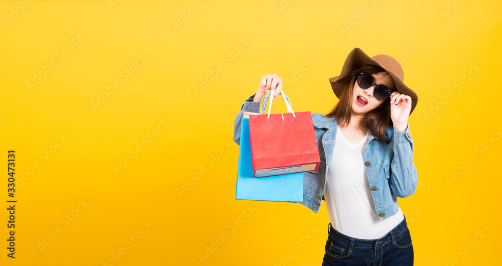 woman teen smiling standing with sunglasses excited holding shopping bags multi color woman teen smiling standing with sunglasses excited holding shopping bags multi color