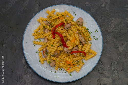 Italian pasta with meat, cheese, spices, parsley and red tomato sauce. Gourmet traditional food