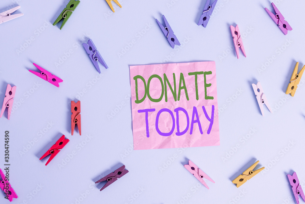 Text sign showing Donate Today. Business photo text time to give money or goods to help a demonstrating or organization Colored clothespin rectangle shaped reminder paper light blue background Text sign showing Donate Today. Business photo text time to give money or goods to help a demonstrating or organization Colored clothespin rectangle shaped reminder paper light blue background