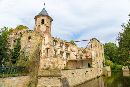 Castle ruin in Harbke in Germany, overgrown with vines photo