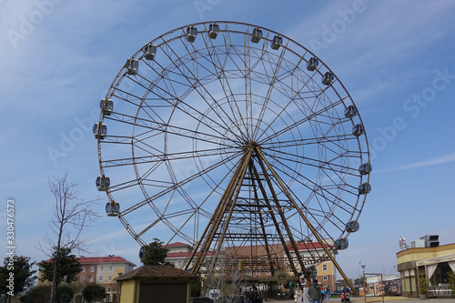 March 13, 2020 Russia Sochi. Ferris wheel on a background of blue sky © Aleksandr