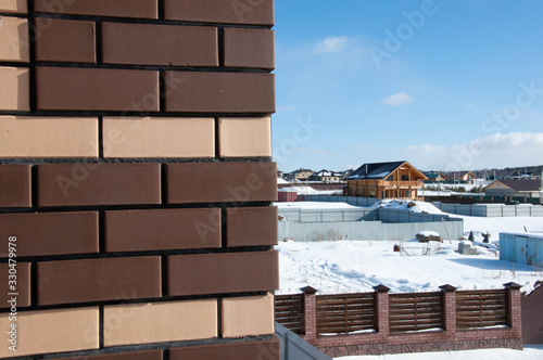 Yellow and brown ceramic brick masonry, house lining, embroidery, background, texture, construction season © Mishi