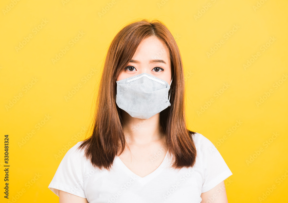 woman standing wear t-shirt making mask protection from virus epidemic or air pollution woman standing wear t-shirt making mask protection from virus epidemic or air pollution