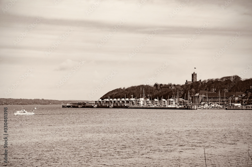 Coast view. Yachts and boats moored in the pier