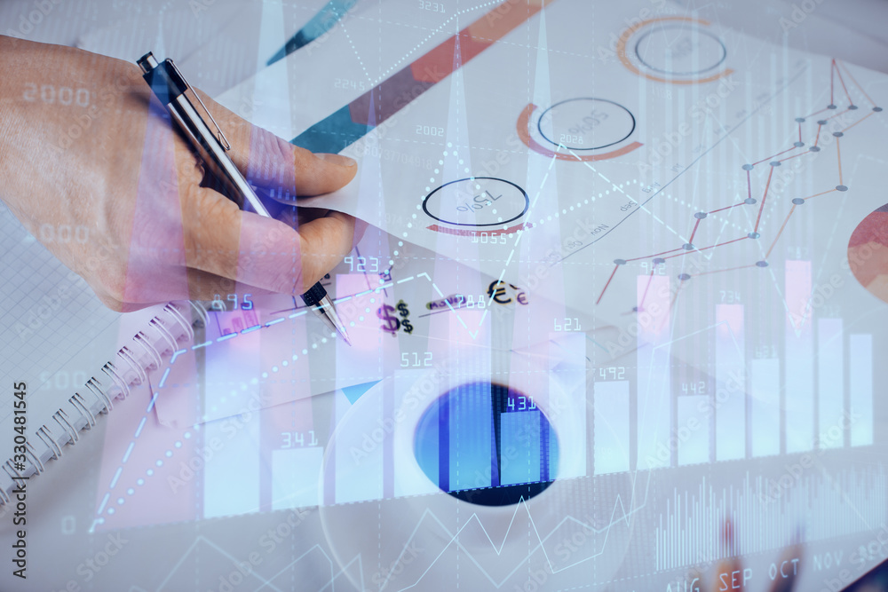 Multi exposure of man planing investment with stock market forex chart. Multi exposure of man planing investment with stock market forex chart.