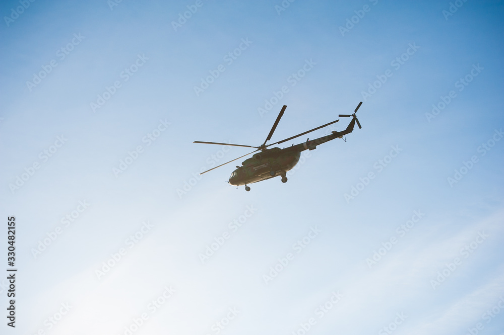 Military helicopter flying during exercise Military helicopter flying during exercise