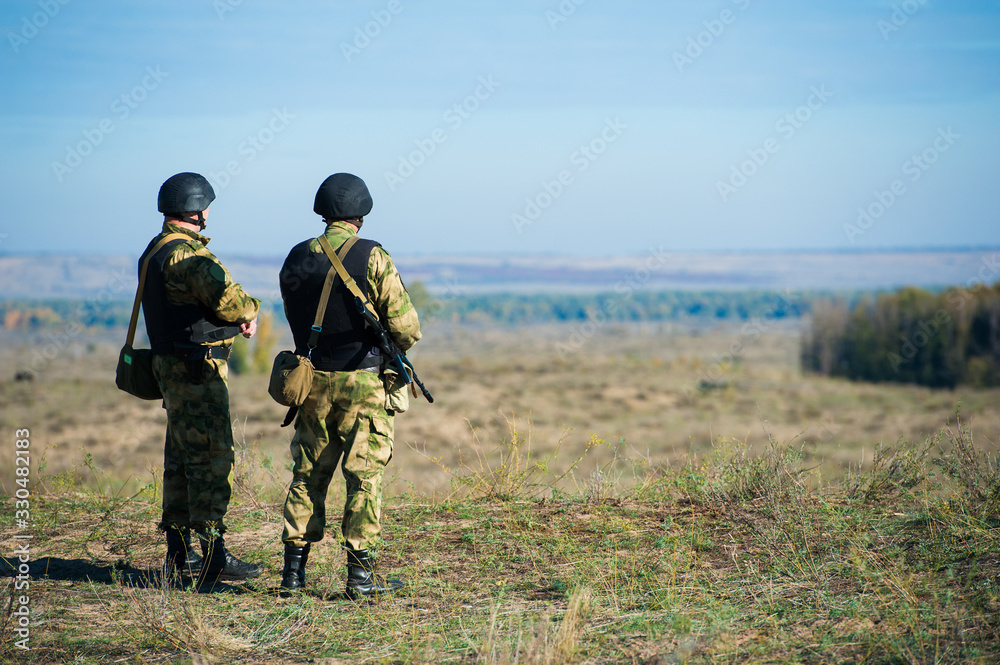Russian special forces soldiers with weapon take part in military maneuver Russian special forces soldiers with weapon take part in military maneuver