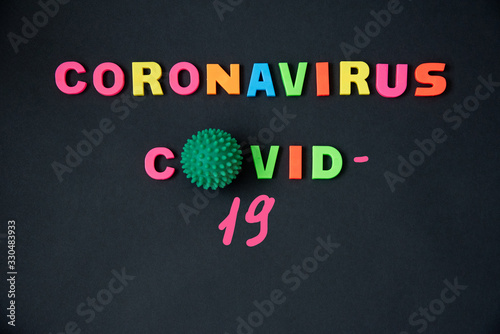 Top view of the word dangerous disease coronavirus on black background