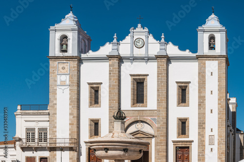 Santo Antao Church and the 15th century Fonte Henriquina Fountain in the Giraldo Square. Renaissance architecture. photo