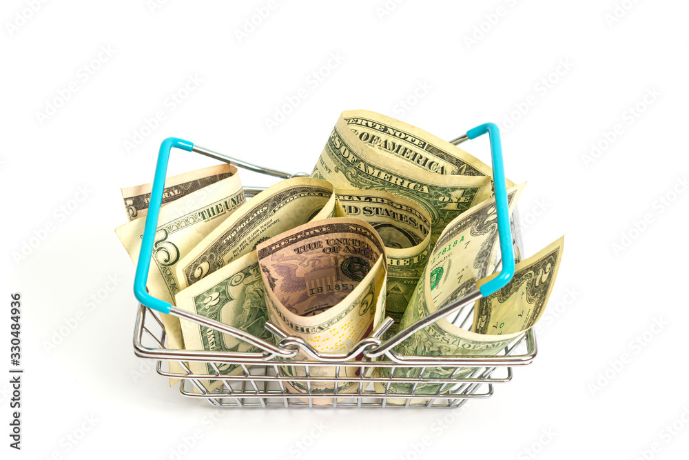 Obraz premium basket with blue inserts inserted into the wrapped dollar bills on a white background. isolate