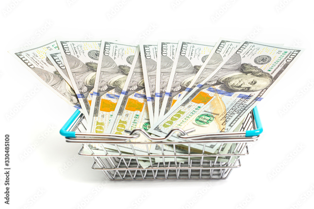 a basket with blue inserts is inserted into the wrapped one hundred dollar bills on a white background. isolate a basket with blue inserts is inserted into the wrapped one hundred dollar bills on a white background. isolate