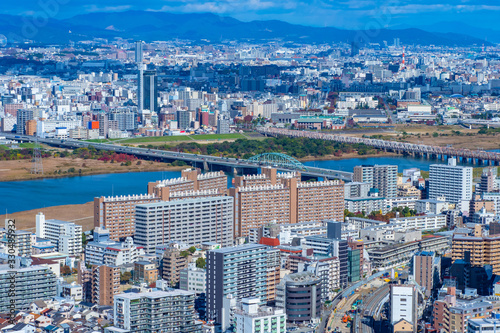 Japan. Osaka. Panorama of the city of Osaka aerial view. View of the Japanese city from a quadrocopter. River flows between the skyscrapers. Japanese architecture. Osaka with a quadcopter.