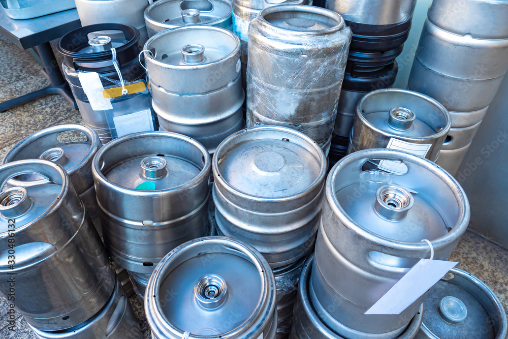 Kegs with beer. Metal barrels for beer machines. Kegs for storing and selling draft beer. Metal barrels stand on top of each other. Concept - Sale of low alcohol drinks. Tokyo. Japan. Kegs with beer. Metal barrels for beer machines. Kegs for storing and selling draft beer. Metal barrels stand on top of each other. Concept - Sale of low alcohol drinks. Tokyo. Japan.