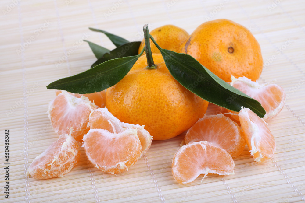 Mandarin oranges on bamboo background Mandarin oranges on bamboo background