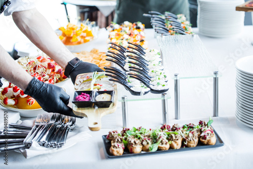 waiter makes the organization of snacks