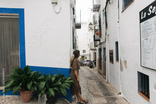 young tourist woman in the streets of the old town of Peniscola, Spain © Victoriya Bulyha