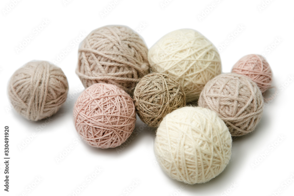 Small balls of yarn of different colors on a white background. Isolated. Small balls of yarn of different colors on a white background. Isolated.