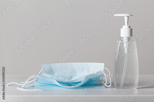 Sanitizer gel or antibacterial soap and face mask for coronavirus preventive measure