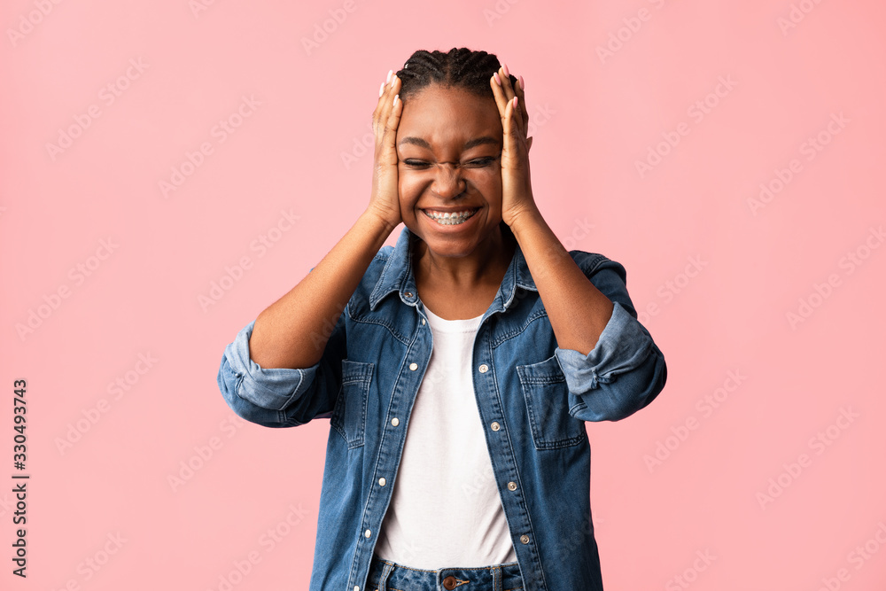 Girl With Braces Smiling With Eyes Closed On Pink Background Girl With Braces Smiling With Eyes Closed On Pink Background