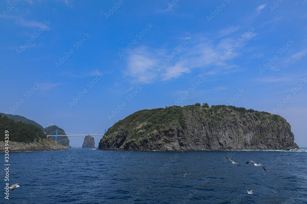 Island Round view of the island and the beautiful view of the sky Island Round view of the island and the beautiful view of the sky