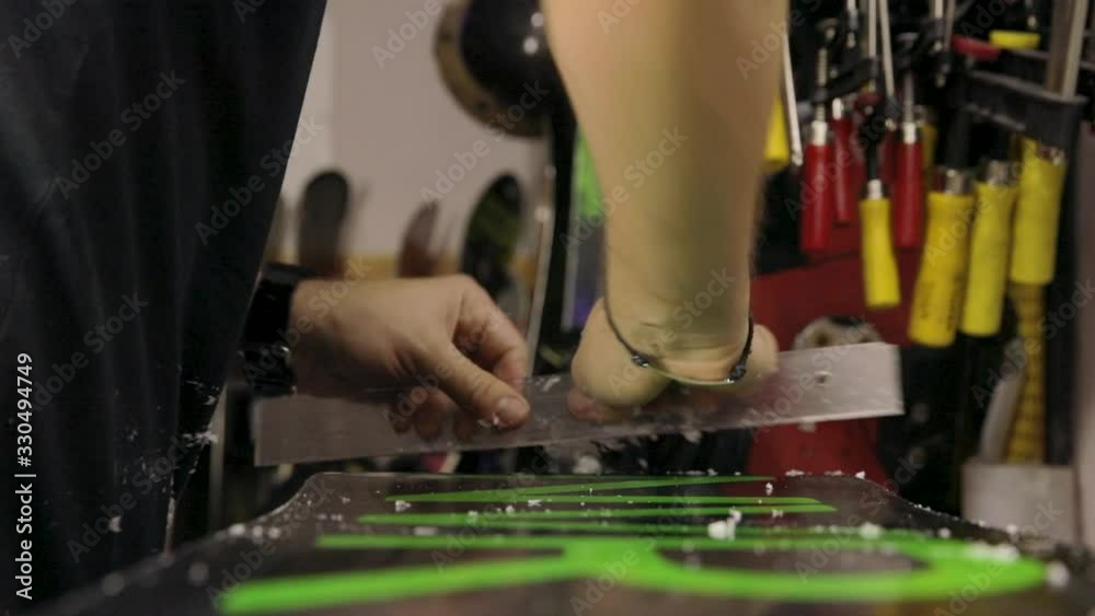 Scraping And Brushing Excess Wax Off Snowboard Scraping And Brushing Excess Wax Off Snowboard