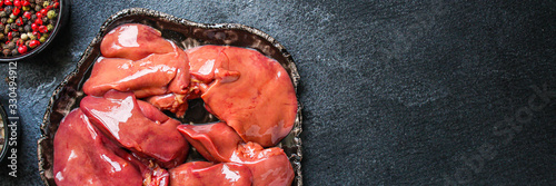 Fototapeta raw chicken liver (healthy eating) keto or paleo diet menu concept background. top view. copy spaces for text