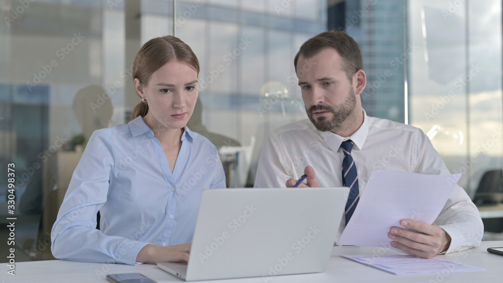 The Business people Discussing project on Laptop Screen The Business people Discussing project on Laptop Screen