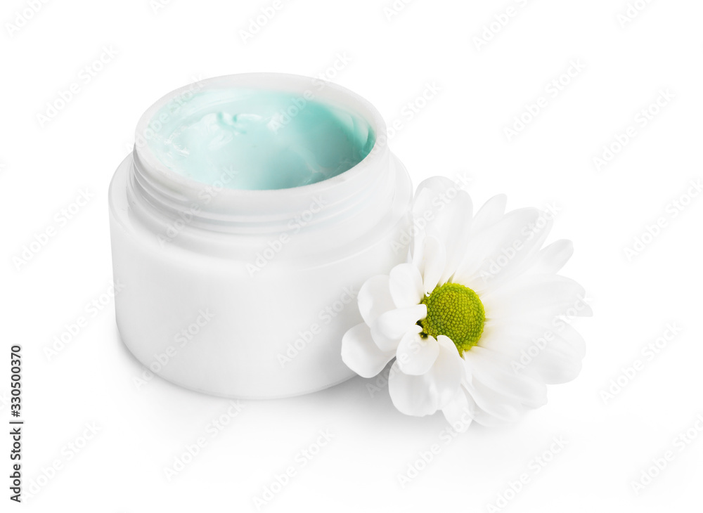 Natural cream in jar with flower isolated on white background Natural cream in jar with flower isolated on white background