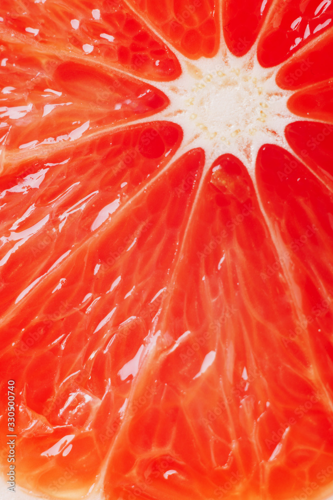 juicy fresh ripe grapefruit in a section close-up, macro juicy fresh ripe grapefruit in a section close-up, macro