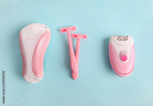Foto Tools for hair removal on  blue background.