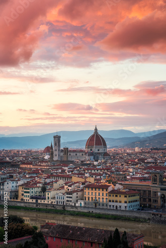 Amazing colorful sunset view of Florence city, Italy with the river Arno and Cathedral of Santa Maria del Fiore.