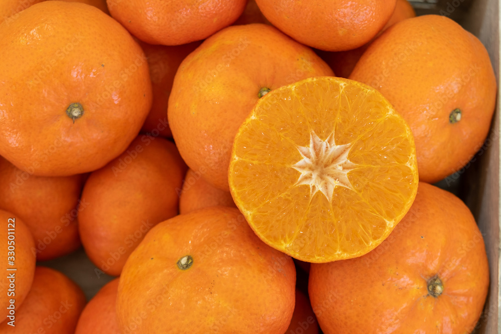 Red orange Mandarins or Clementines at an agricultural exhibition