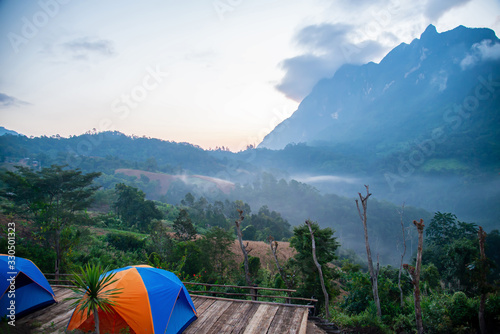 ฺBeautiful morning in the mountains and orange tent at district,Chiang Mai province thailand photo